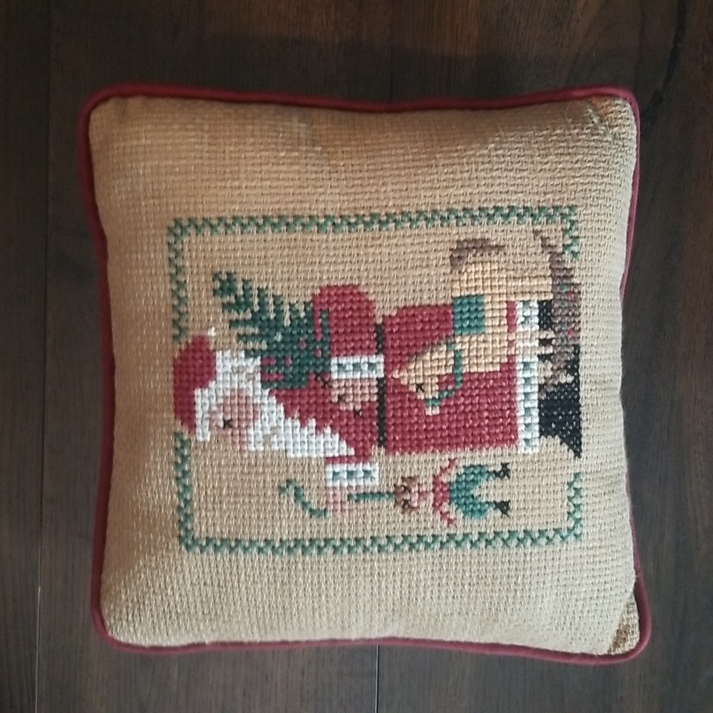Needlepoint Santa with toys pillow. Approx 11 x 11 inches.